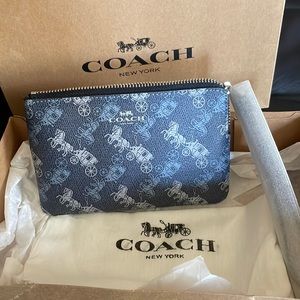 COACH wristlet. BRAND NEW.